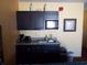 This kitchenette has a coffee maker, a sink, and microwave at 1501 S Ocean Blvd. # 1009, Myrtle Beach, SC 29577