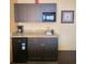 Convenient kitchenette featuring granite countertops, microwave, mini-fridge and coffee maker at 1501 S Ocean Blvd. # 1009, Myrtle Beach, SC 29577