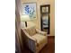 Bedroom featuring an accent chair, cool artwork, and mirror, creating a relaxing retreat at 1501 S Ocean Blvd. # 1107, Myrtle Beach, SC 29577