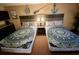Comfortable bedroom with two beds, nautical décor, and a modern aesthetic at 1501 S Ocean Blvd. # 1107, Myrtle Beach, SC 29577