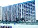 Oceanfront exterior view of the building with balconies and beach access at 1501 S Ocean Blvd. # 1107, Myrtle Beach, SC 29577