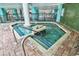Indoor hot tub surrounded by brick flooring and green tile accents for a relaxing experience at 1501 S Ocean Blvd. # 1107, Myrtle Beach, SC 29577