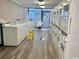 Well-lit laundry room featuring rows of washing machines and utility sink at 1501 S Ocean Blvd. # 1107, Myrtle Beach, SC 29577