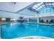 Indoor pool area with a fountain feature, skylight, and seating at 1501 S Ocean Blvd. # 1107, Myrtle Beach, SC 29577