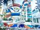 Exterior image showcasing a colorful waterpark with thrilling slides and lounge chairs for relaxation at 1501 S Ocean Blvd. # 1107, Myrtle Beach, SC 29577
