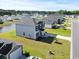Desirable neighborhood home featuring a water view, manicured lawn, sidewalks, and backyard privacy at 153 Foxford Dr., Conway, SC 29526