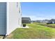 View of a well-maintained backyard with green lawn and nearby creek offering scenic views at 153 Foxford Dr., Conway, SC 29526