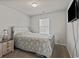 Neutral bedroom with a cozy bed, side table, and window providing natural light at 153 Foxford Dr., Conway, SC 29526