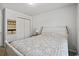 Spacious bedroom with a decorative wall hanging, closet and large bed with night stand at 153 Foxford Dr., Conway, SC 29526