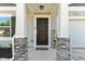 Home featuring a welcoming front entry, stone pillars, 'Welcome Home' mat, and classic style at 153 Foxford Dr., Conway, SC 29526
