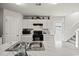 Bright kitchen features white cabinets, marble countertops, and modern appliances, perfect for cooking at 153 Foxford Dr., Conway, SC 29526