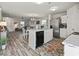 Open concept kitchen and dining area with a kitchen island, stainless steel appliances, and hardwood floors at 153 Foxford Dr., Conway, SC 29526