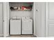 Bright laundry area with white front load washer and dryer at 153 Foxford Dr., Conway, SC 29526