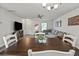 Open concept living room featuring a ceiling fan, neutral decor, and comfortable gray sectional sofa at 153 Foxford Dr., Conway, SC 29526