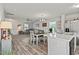 Open concept kitchen and living room area, with a breakfast bar, stainless appliances and hardwood floors at 153 Foxford Dr., Conway, SC 29526