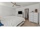 Well-lit main bedroom featuring a TV, dresser and ensuite bathroom at 153 Foxford Dr., Conway, SC 29526