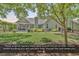 Well-maintained backyard with lush lawn, mature landscaping, and a cozy screened-in porch at 156 Summerlight Dr., Murrells Inlet, SC 29576