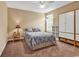 Comfortable bedroom with a ceiling fan, window with shutters, and a spacious wardrobe at 156 Summerlight Dr., Murrells Inlet, SC 29576