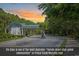 Gated community entrance with lush landscaping and a secure access point at 156 Summerlight Dr., Murrells Inlet, SC 29576