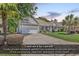 Charming single-story home features a well-manicured lawn, mature landscaping, and an attached two-car garage at 156 Summerlight Dr., Murrells Inlet, SC 29576
