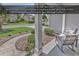 Inviting front porch features comfortable seating and views of the manicured landscaping and quiet street at 156 Summerlight Dr., Murrells Inlet, SC 29576
