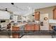 Kitchen with bar seating and tankless gas hot water system at 156 Summerlight Dr., Murrells Inlet, SC 29576