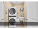 Functional laundry room with stacked washer/dryer and a convenient laundry sink at 156 Summerlight Dr., Murrells Inlet, SC 29576