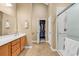 Main bathroom with double sink vanity, walk-in closet, and glass enclosed shower at 156 Summerlight Dr., Murrells Inlet, SC 29576