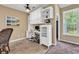 Bright office with custom built-in shelving, cabinets, desk, and large window for natural light at 156 Summerlight Dr., Murrells Inlet, SC 29576