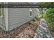 Well-maintained side yard with beautiful landscaping featuring a convenient paver path at 156 Summerlight Dr., Murrells Inlet, SC 29576