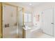 Relaxing bathroom with separate shower, soaking tub, and ample natural light at 1617 Tradition Club Dr., Pawleys Island, SC 29585
