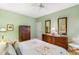 Well-lit bedroom featuring neutral-toned walls, two large dressers, and ample storage at 1617 Tradition Club Dr., Pawleys Island, SC 29585