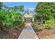Clubhouse exterior with colorful landscaping and well maintained grounds at 1617 Tradition Club Dr., Pawleys Island, SC 29585
