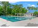 Enjoy this community pool with shade and places to relax with a bright blue roofed building at 1617 Tradition Club Dr., Pawleys Island, SC 29585