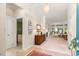 Bright entryway featuring neutral paint, carpet, and stylish decor leading into the living area at 1617 Tradition Club Dr., Pawleys Island, SC 29585