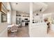 Open kitchen with stainless steel appliances, white cabinets, and adjacent breakfast nook at 1617 Tradition Club Dr., Pawleys Island, SC 29585