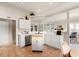 Functional kitchen with white cabinets, solid surface countertops, and a breakfast bar at 1617 Tradition Club Dr., Pawleys Island, SC 29585