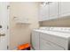 Practical laundry room with ample storage and modern washer and dryer units at 1617 Tradition Club Dr., Pawleys Island, SC 29585