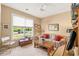 Cozy living room with large window, comfortable seating, and natural light at 1617 Tradition Club Dr., Pawleys Island, SC 29585