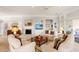Cozy living room featuring a fireplace, built-in shelving, and neutral decor at 1617 Tradition Club Dr., Pawleys Island, SC 29585