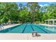 Outdoor community pool with lounge chairs and shade umbrellas at 1617 Tradition Club Dr., Pawleys Island, SC 29585