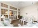 Well lit sunroom with a ceiling fan and an open view to the home's interior at 1617 Tradition Club Dr., Pawleys Island, SC 29585