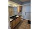 Well-lit bathroom with a double sink vanity, plenty of cabinet space, and a shower with glass doors at 1625 S Ocean Blvd. # 106, North Myrtle Beach, SC 29582
