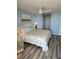 Comfortable bedroom featuring a plush bed, ceiling fan, and stylish decor for a relaxing retreat at 1625 S Ocean Blvd. # 106, North Myrtle Beach, SC 29582