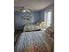 Serene bedroom with two beds, soft colors, and a beach-themed painting at 1625 S Ocean Blvd. # 106, North Myrtle Beach, SC 29582