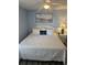 Cozy bedroom with a comfortable bed, soft pillows, and a calming beach view painting at 1625 S Ocean Blvd. # 106, North Myrtle Beach, SC 29582