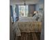 Bright bedroom with balcony access offering a glimpse of the ocean, creating a serene ambiance at 1625 S Ocean Blvd. # 106, North Myrtle Beach, SC 29582