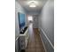 Inviting hallway with light blue walls and tile floors leading to a spacious condo interior at 1625 S Ocean Blvd. # 106, North Myrtle Beach, SC 29582