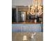 Bright kitchen with stainless steel appliances, granite countertops, open to dining area with chandelier at 1625 S Ocean Blvd. # 106, North Myrtle Beach, SC 29582