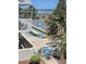 Outdoor pool area with lounge chairs and palm trees, offering a relaxing vacation spot near the beach at 1625 S Ocean Blvd. # 106, North Myrtle Beach, SC 29582
